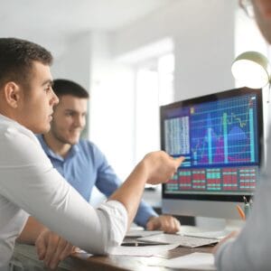 Marketing team reviewing analytics for campaign performance