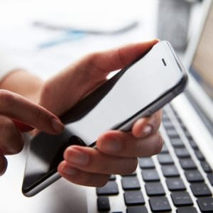 Person frustrated while using a slow-loading website on mobile